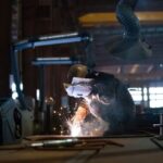 China’s factory activity returns to growth in December, ending eight months of decline