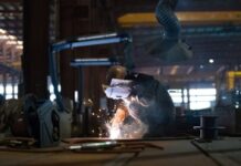 China’s factory activity returns to growth in December, ending eight months of decline