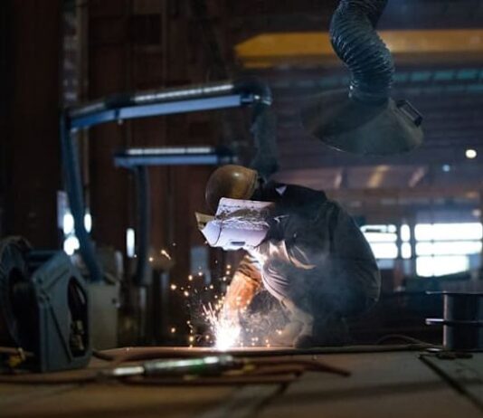 China’s factory activity returns to growth in December, ending eight months of decline