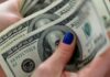 Dollar holds gains against sterling, yen as central bank decisions loom