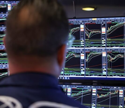 Stocks rise, yields and dollar fall after Fed cuts interest rates