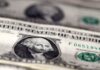US dollar gains after jobs report, as Fed decision nears