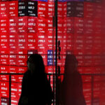 US stocks ease from record highs, world indexes headed for double-digit annual gains