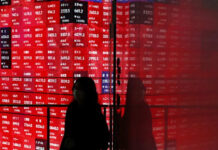 US stocks ease from record highs, world indexes headed for double-digit annual gains