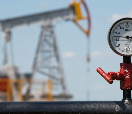 Oil holds near six-month high as investors track US-Iran tensions