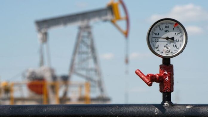 Oil holds near six-month high as investors track US-Iran tensions