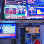 US Fed holds interest rates steady, defying Trump pressure