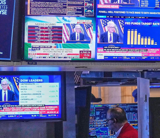 US Fed holds interest rates steady, defying Trump pressure