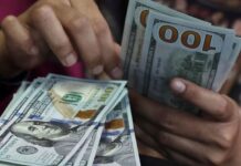 Dollar holds gains on economic data, Fed bets; Aussie advances before RBA