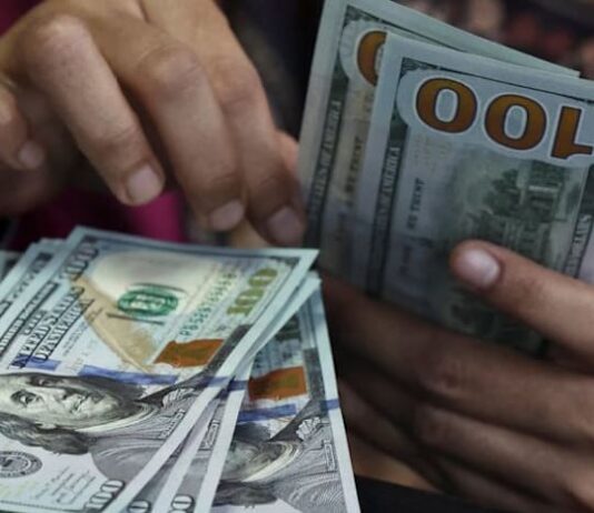 Dollar holds gains on economic data, Fed bets; Aussie advances before RBA