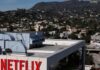 Exclusive-Netflix has ample room to increase its offer in battle for Warner Bros, sources say