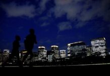 Japan says companies can rebuff unsolicited bids amid takeover risk concerns