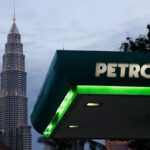 Petronas sees profit slide for third straight year as oil prices weigh on margins