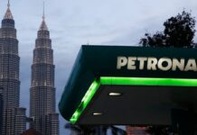 Petronas sees profit slide for third straight year as oil prices weigh on margins
