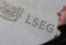 Stocks hit record highs; Treasury yields fall after US data