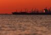 Crude tumbles, stocks rally on hopes for Iran war de-escalation