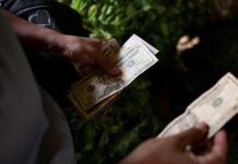Dollar scarcity in Venezuela forces small firms to raise prices, turn to crypto