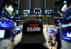 Dow confirms correction as traders worry about war