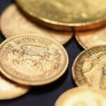 Gold dives to four-month low as inflation pressures lift rate hike bets