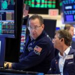 Oil slides, stocks climb on Trump’s Iran reprieve