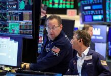 Oil slides, stocks climb on Trump’s Iran reprieve