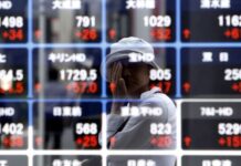 Asian shares climb, oil holds gains as markets eye Iran talks, central bank moves