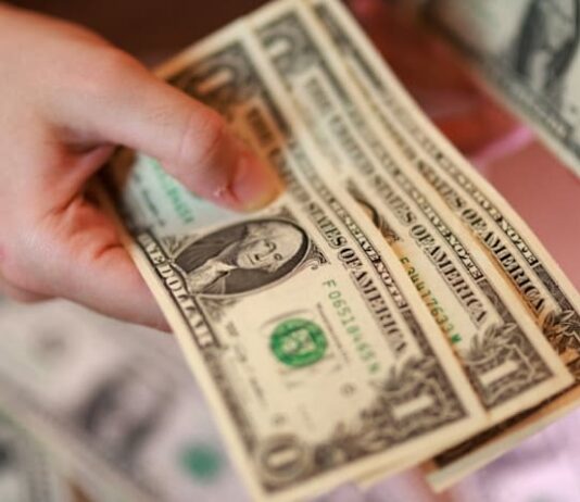 Dollar edges up as investors weigh Iran peace hopes against Fed rate outlook