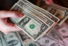 Dollar firms as oil climbs, bond rout saps risk appetite