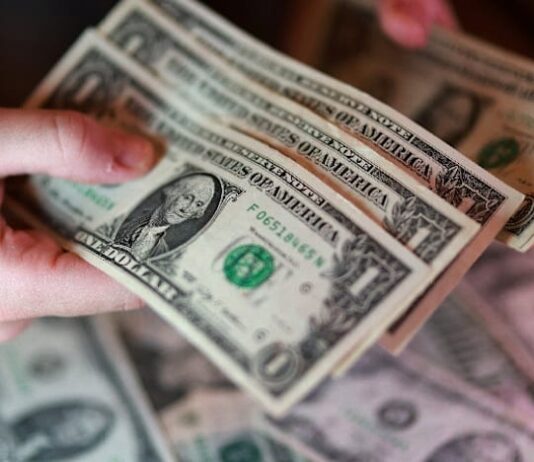 Dollar firms as oil climbs, bond rout saps risk appetite