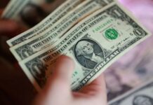 Dollar firms as US-Iran hostilities flare, yen steadied by intervention risk