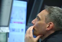 Global stocks surge and oil slides on Iran peace deal report