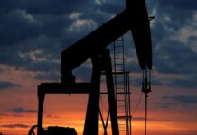 Oil settles higher as hopes of peace in the Middle East dwindle