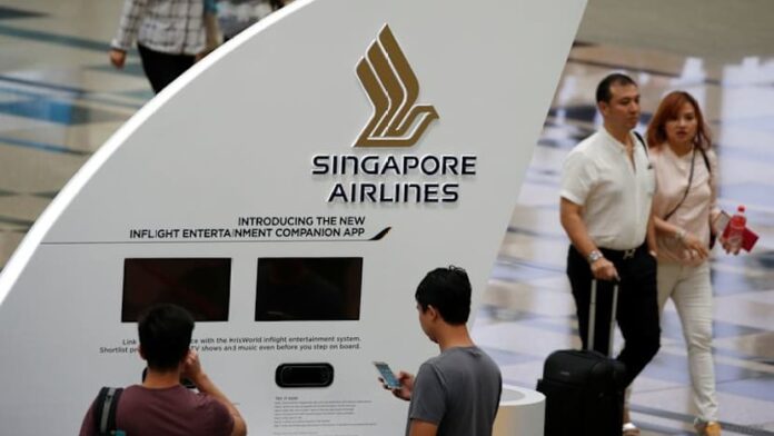 Singapore Airlines flags surging fuel costs; annual profit halves on one-offs