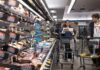 US revises first quarter growth down while inflation climbs
