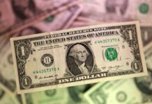 Dollar firms as markets await Fed decision and Warsh debut