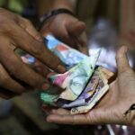 Indonesian central bank says governor briefs foreign investors following surprise rate hike