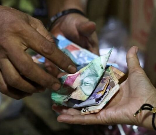 Indonesian central bank says governor briefs foreign investors following surprise rate hike