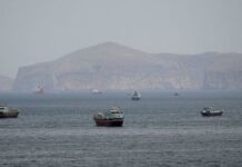 Oil slips again as US, Iran sign peace deal