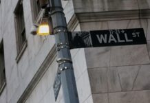 Stocks hold near record highs as AI optimism trumps Iran tensions