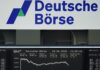 Stocks slip as Fed rate outlook offsets optimism over Iran deal