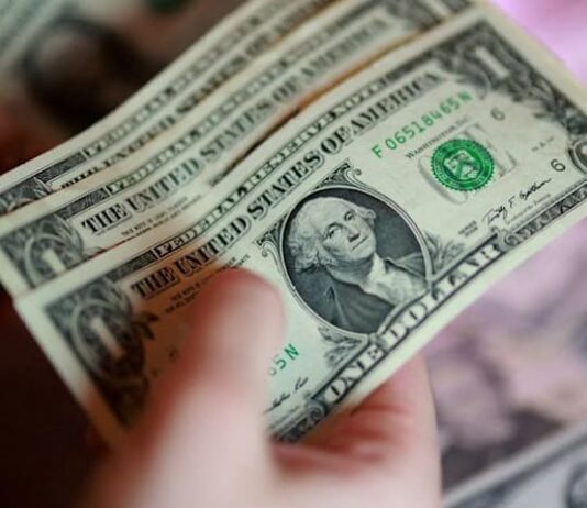 Dollar mostly flat amid escalating US-Iran tension, yen slides on pension doubts
