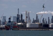 Oil falls by more than 1% after OPEC+ agrees to raise output targets