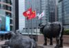 Shares edge higher in Asia as oil dips, earnings loom