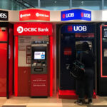 Singapore bank stocks are at record highs. Should you buy, hold or sell?