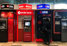 Singapore bank stocks are at record highs. Should you buy, hold or sell?