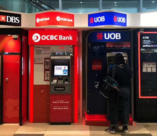 Singapore bank stocks are at record highs. Should you buy, hold or sell?