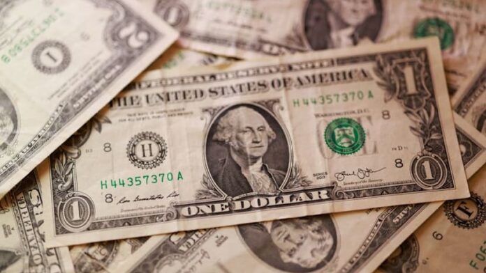 Dollar higher after Iran sanctions, loonie drops after US announces tariff increases