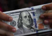 Dollar mostly flat as softer US data fuel dovish rate bets