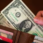 Dollar struggles for traction as markets weigh Iran sanctions, Treasury buybacks