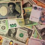 Dollar gains, euro slips after expected ECB rate increase